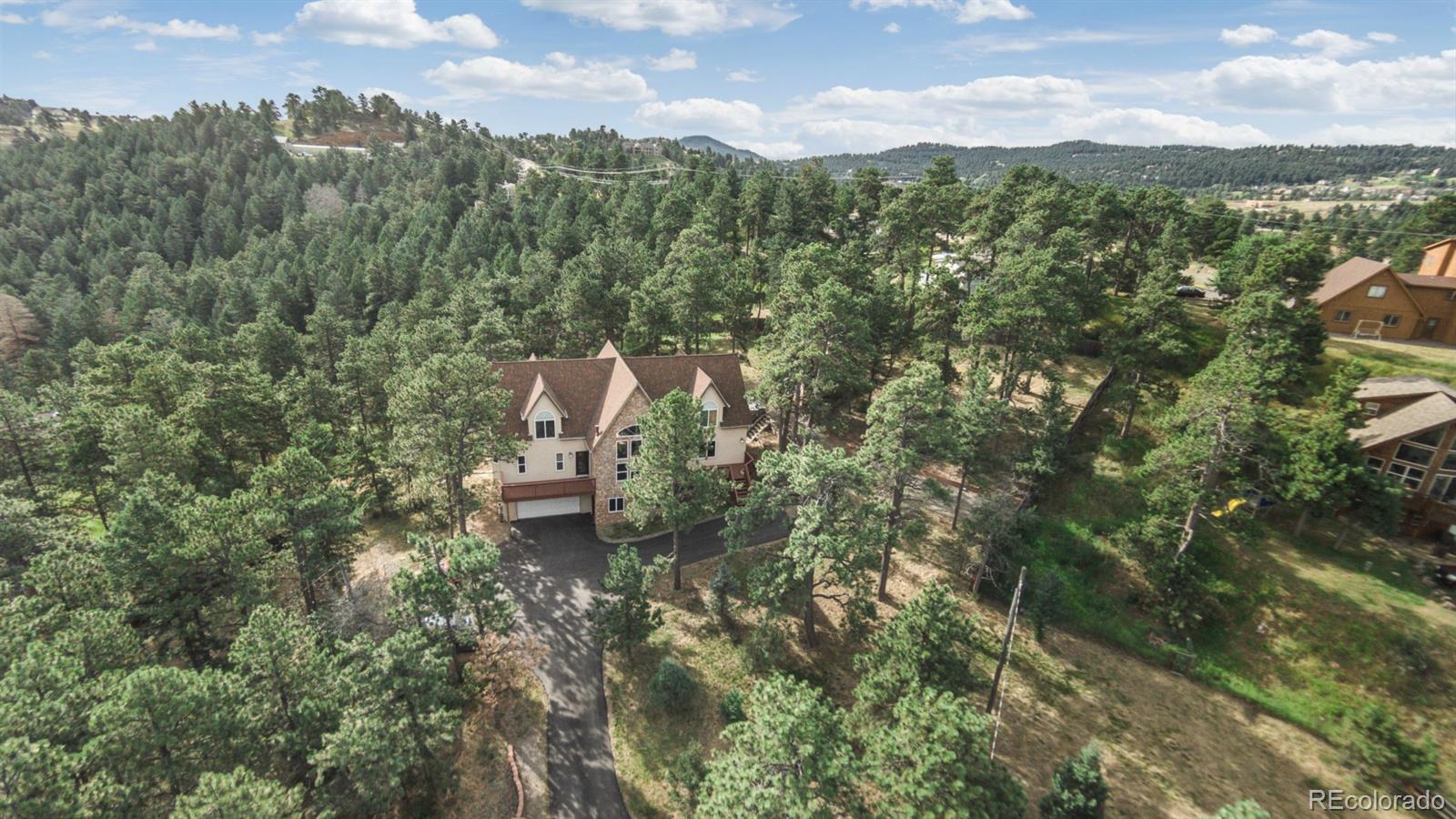 50 South Pine Road Golden, CO 80401 - Photo 11 of 35 a view of a city with lush green forest
