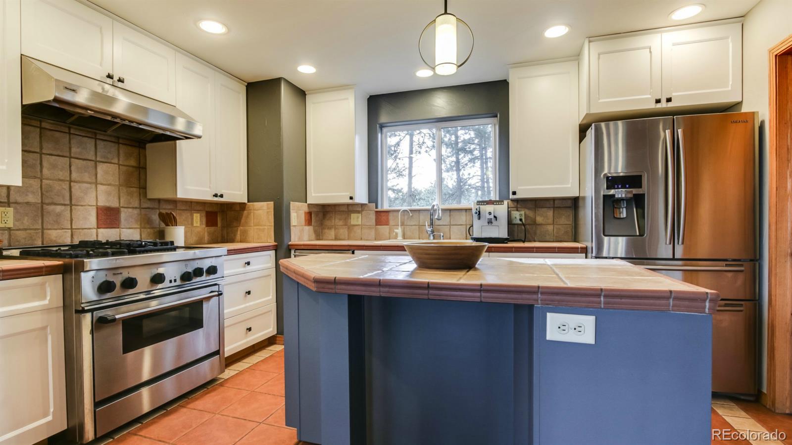 50 South Pine Road Golden, CO 80401 - Photo 16 of 35 a kitchen with stainless steel appliances granite countertop a sink stove and refrigerator