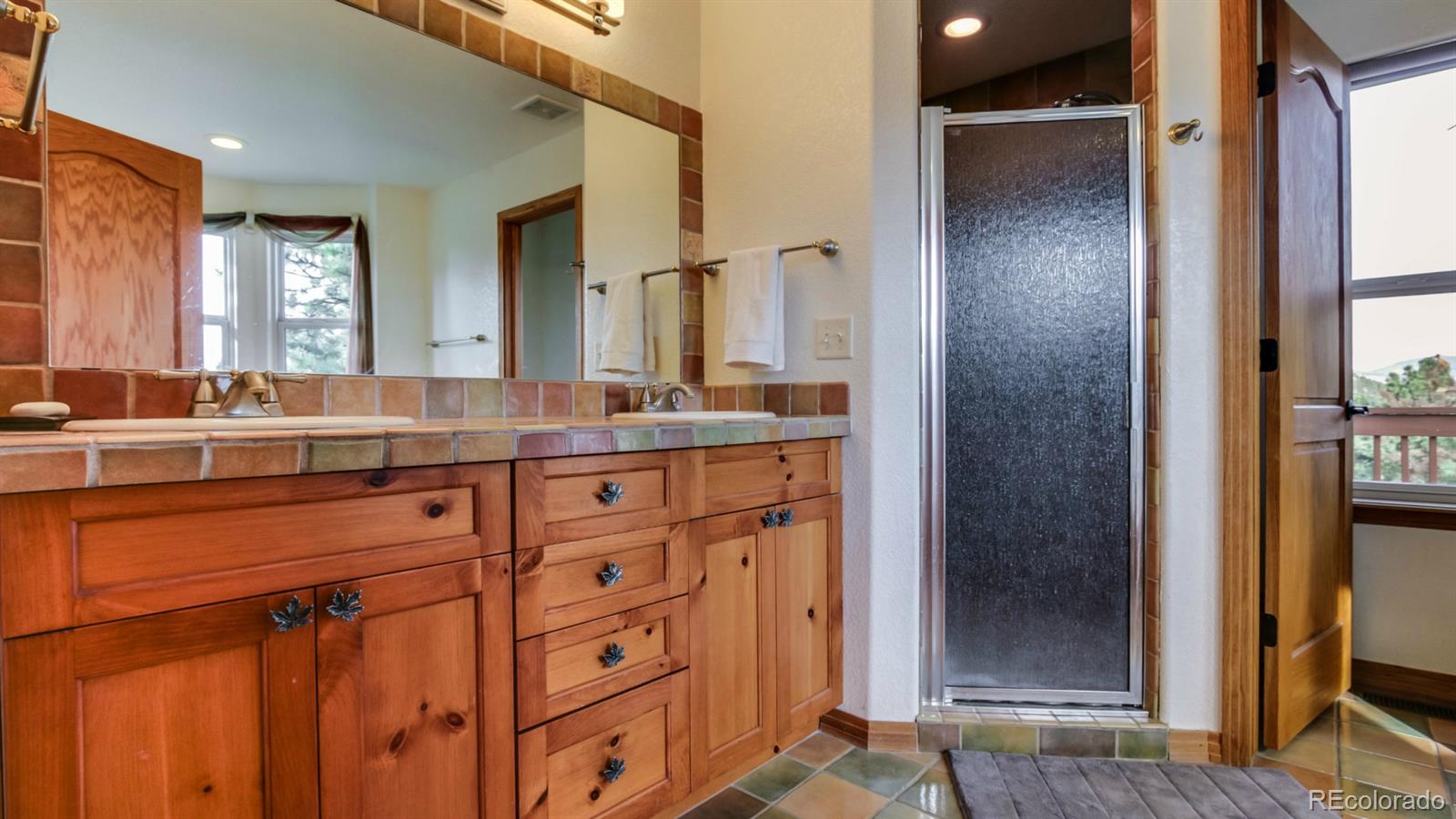 50 South Pine Road Golden, CO 80401 - Photo 19 of 35 a bathroom with a sink and a mirror