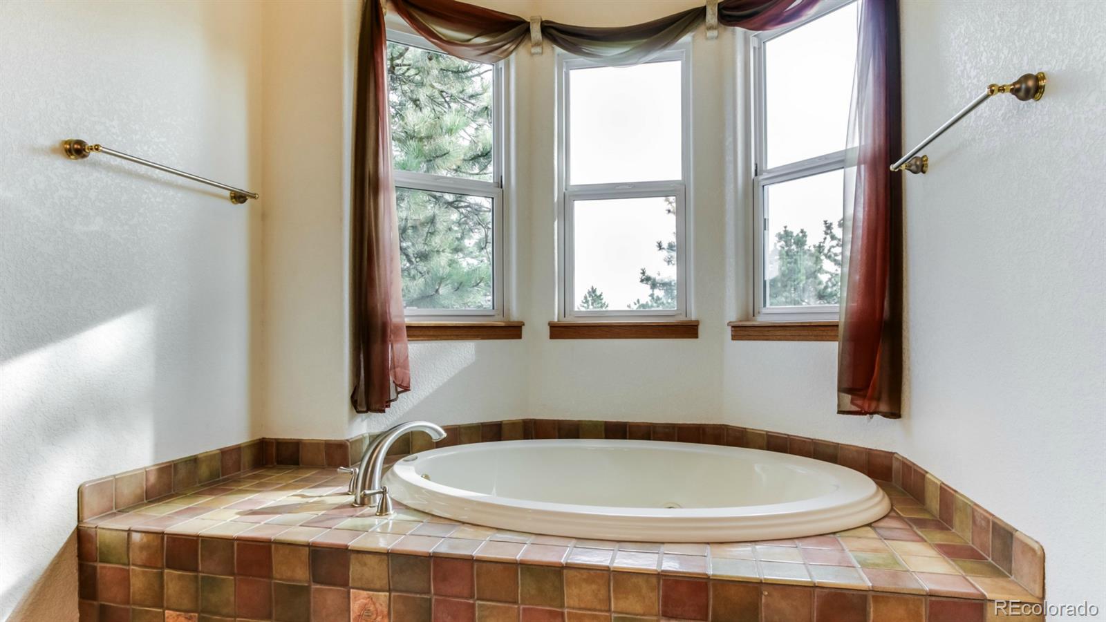 50 South Pine Road Golden, CO 80401 - Photo 20 of 35 a bathroom with a granite countertop sink and a mirror