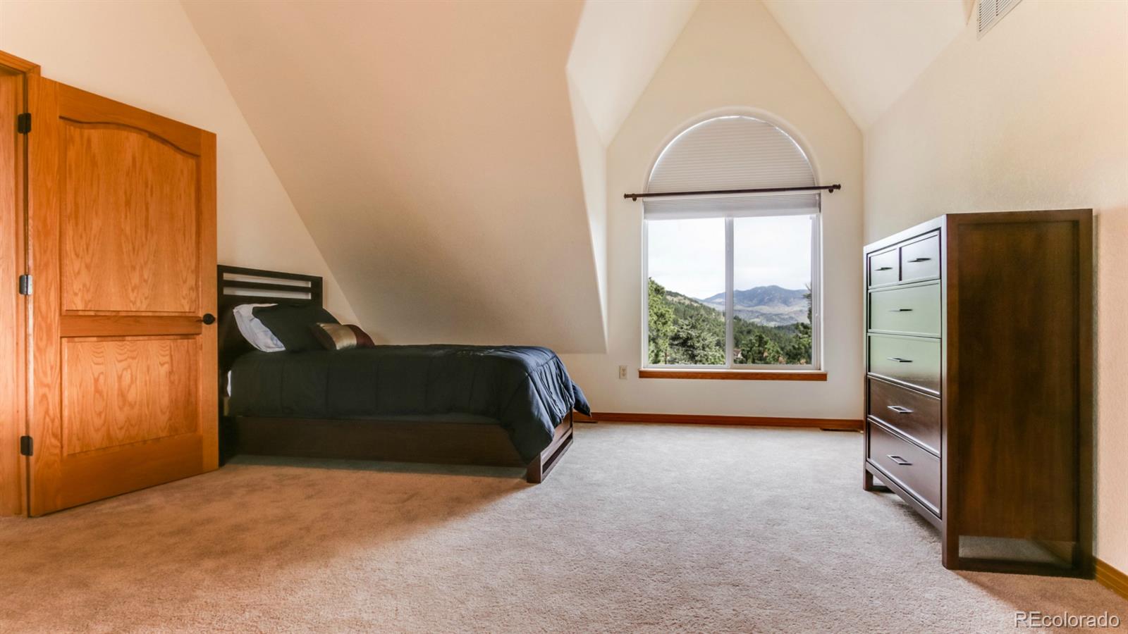 50 South Pine Road Golden, CO 80401 - Photo 24 of 35 a bedroom with a bed and a window