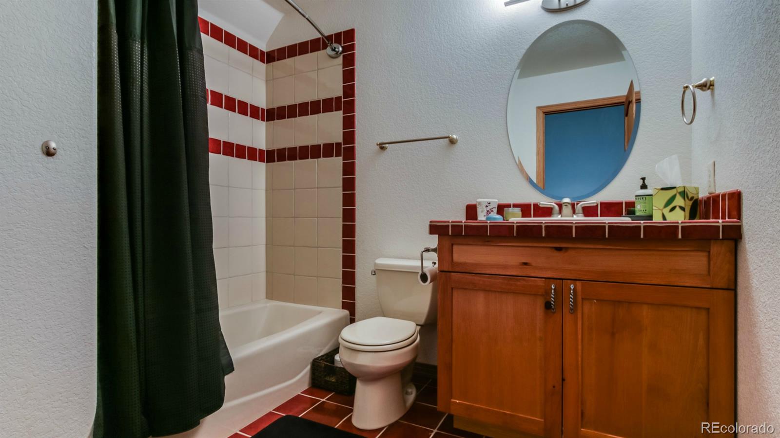 50 South Pine Road Golden, CO 80401 - Photo 26 of 35 a bathroom with a toilet a sink and a mirror