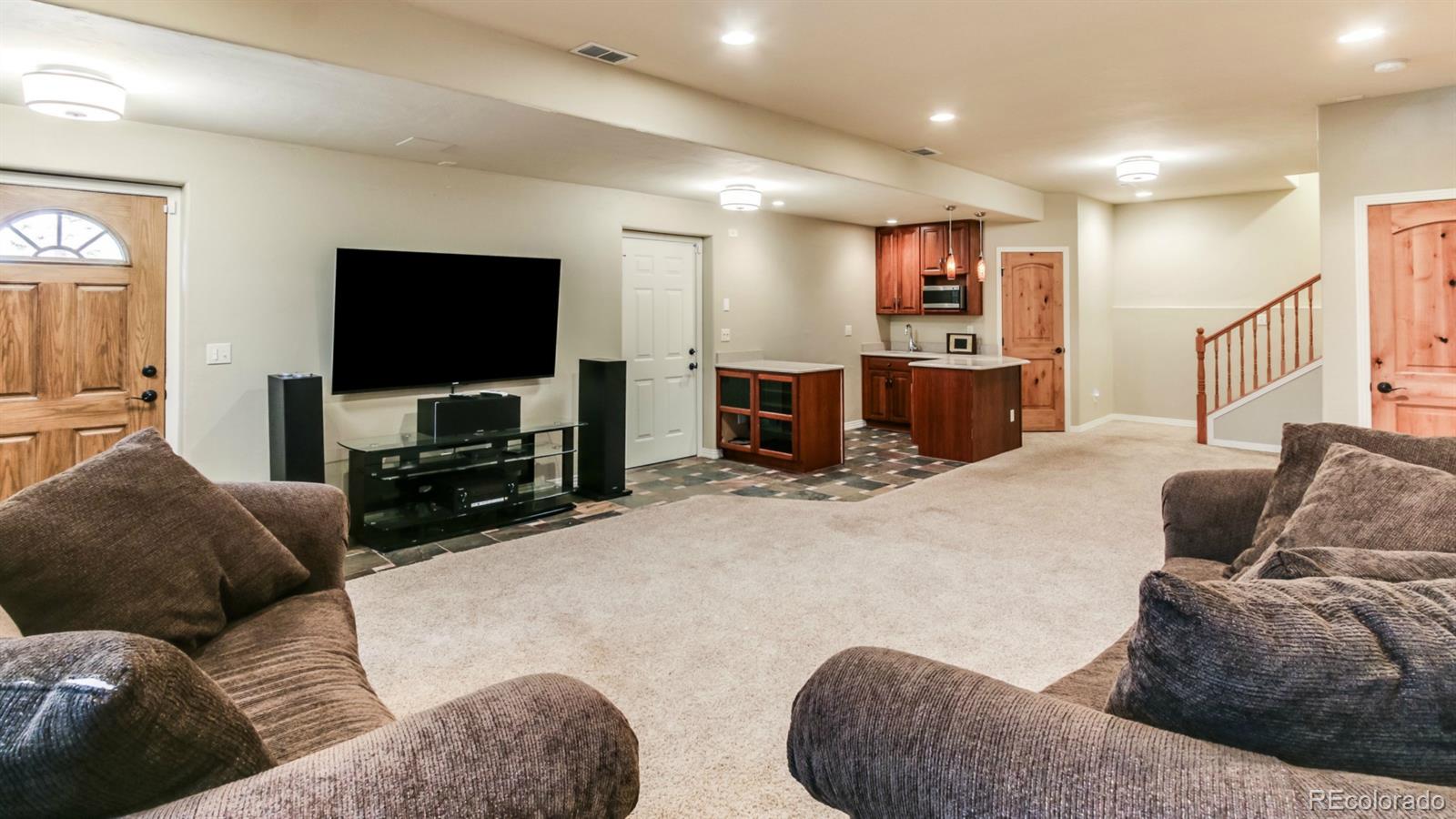50 South Pine Road Golden, CO 80401 - Photo 30 of 35 a living room with furniture and a flat screen tv