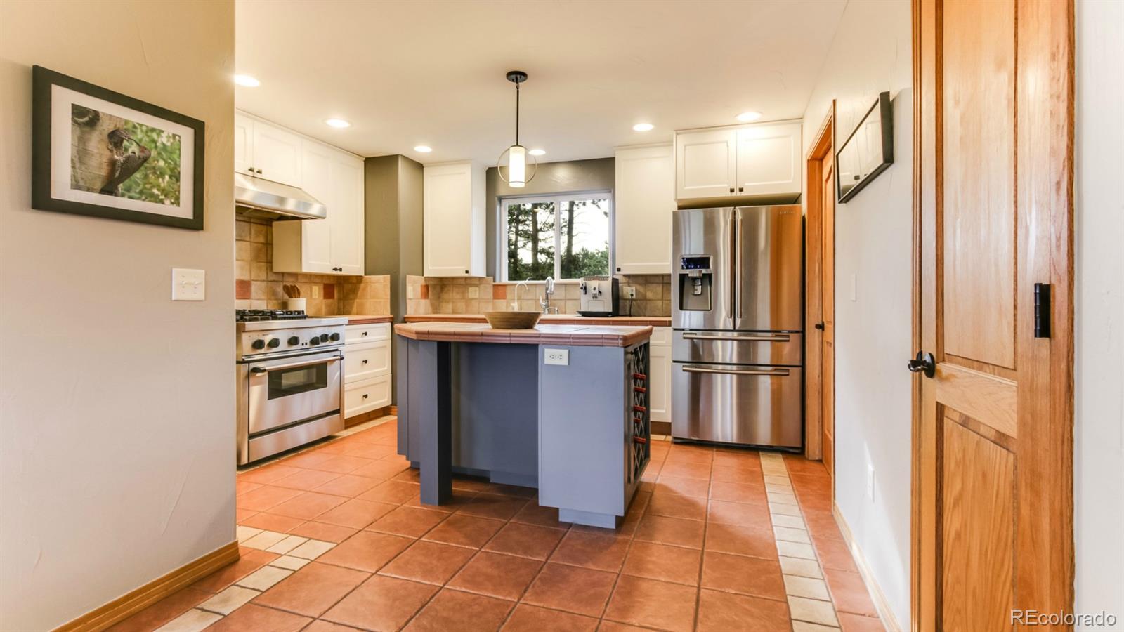 50 South Pine Road Golden, CO 80401 - Photo 5 of 35 a kitchen with stainless steel appliances granite countertop a stove a sink and a refrigerator