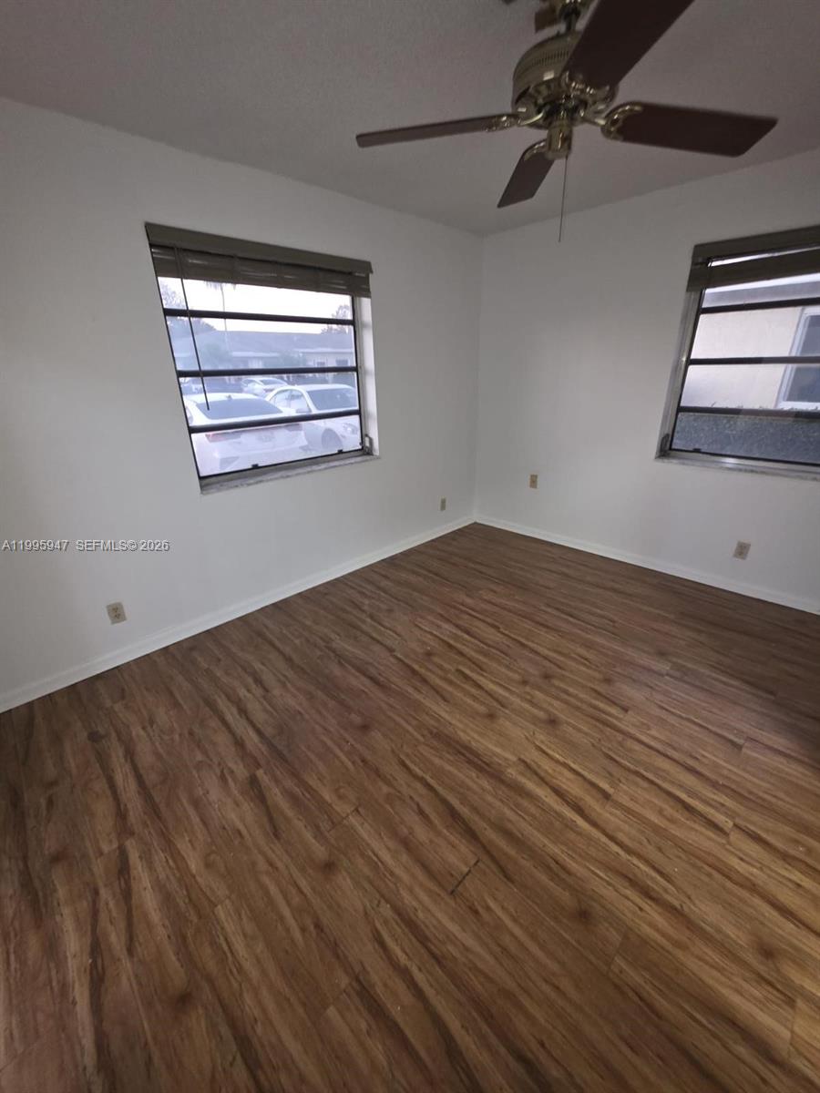 13731 Flora Place, Unit A Delray Beach, FL 33484 - Photo 19 of 21 wooden floor in an empty room