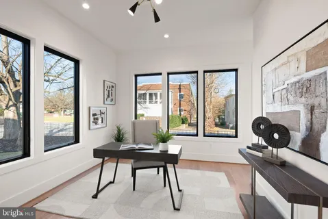 a large kitchen with stainless steel appliances granite countertop a stove and a refrigerator