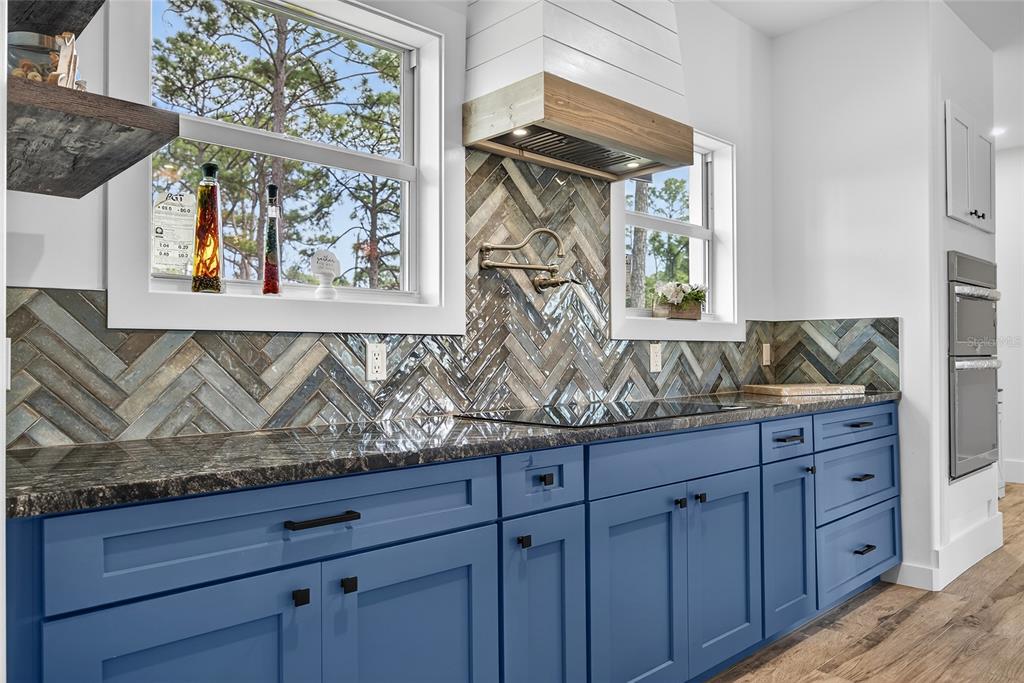 14192 Riseley Avenue Port Charlotte, FL 33953 - Photo 11 of 54 a bathroom with a granite countertop sink and a window
