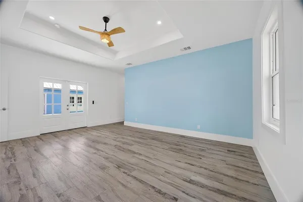 a room with a couch and cabinets