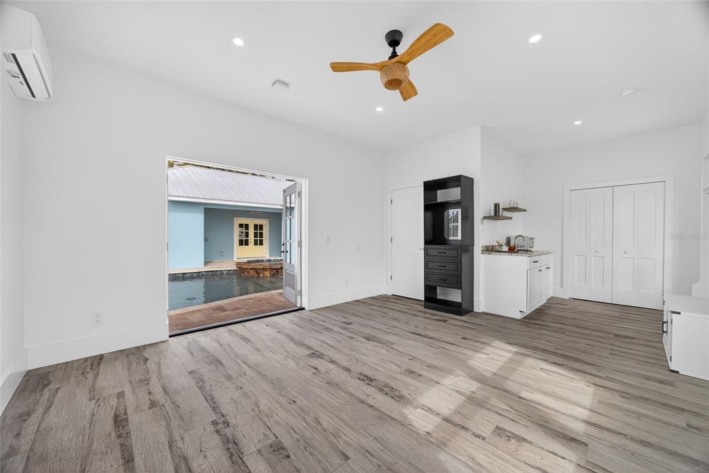 14192 Riseley Avenue Port Charlotte, FL 33953 - Photo 29 of 54 a view of empty room with wooden floor and ceiling fan