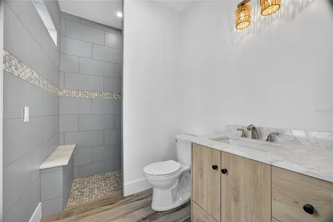 a view of a house with backyard porch and sitting area