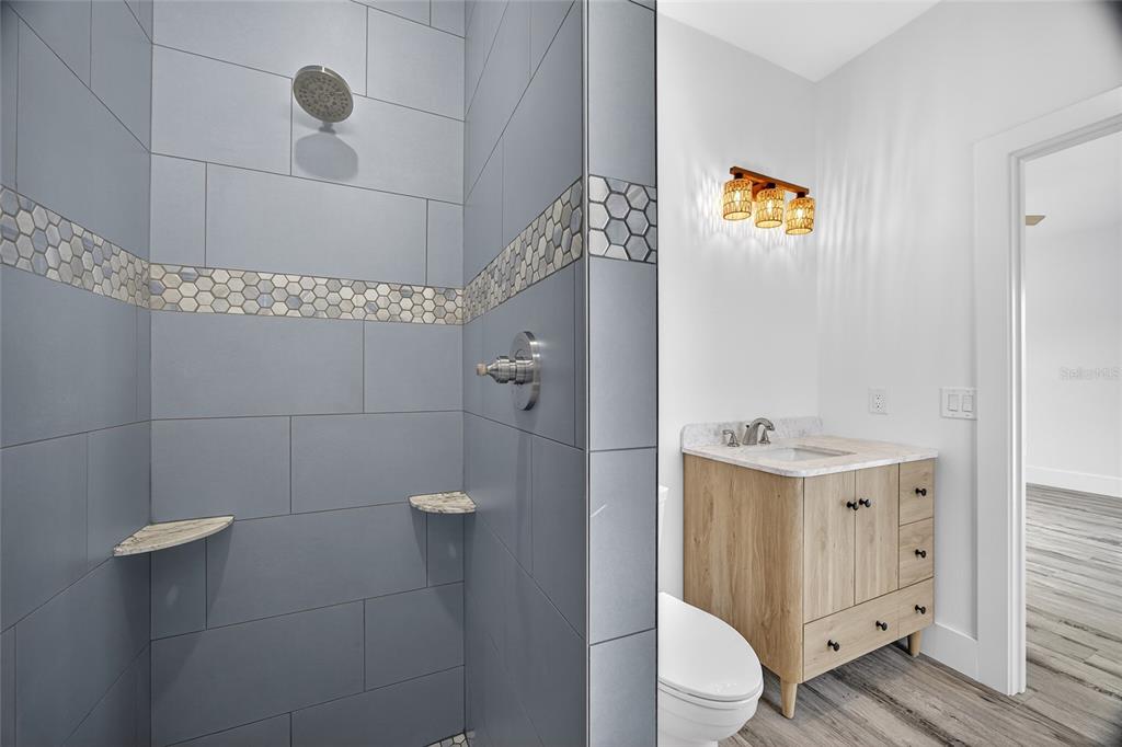 14192 Riseley Avenue Port Charlotte, FL 33953 - Photo 33 of 54 a bathroom with a sink a toilet and shower