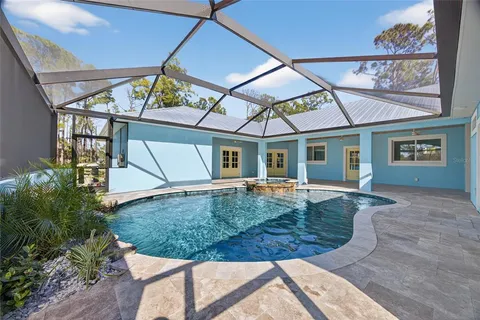 a view of a house with backyard and porch