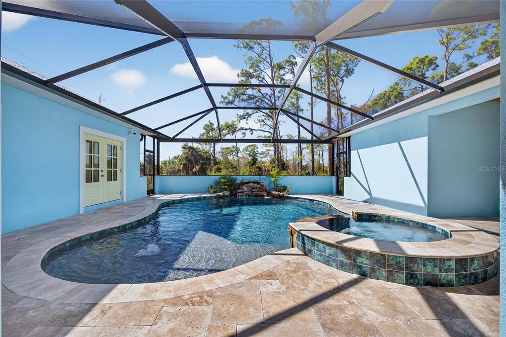 14192 Riseley Avenue Port Charlotte, FL 33953 - Photo 37 of 54 a view of a swimming pool with a patio
