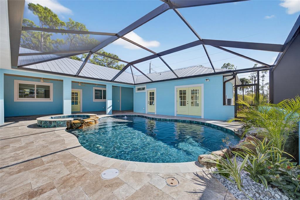 14192 Riseley Avenue Port Charlotte, FL 33953 - Photo 40 of 54 a view of a house with backyard and porch