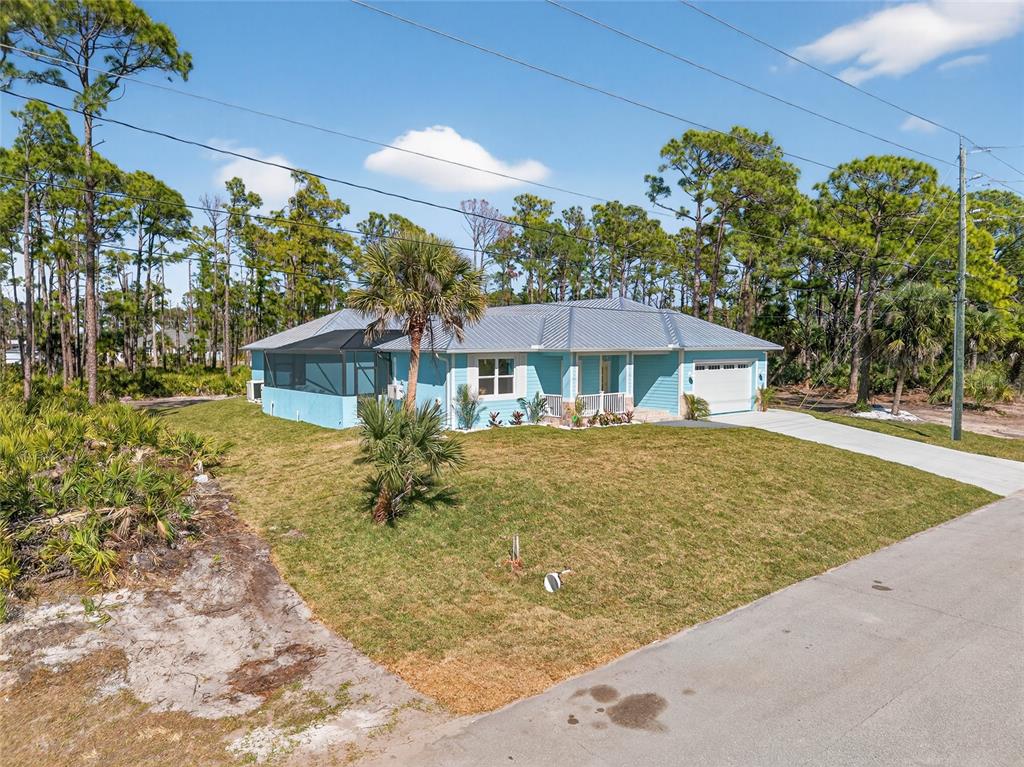 14192 Riseley Avenue Port Charlotte, FL 33953 - Photo 52 of 54 a front view of a house with a yard