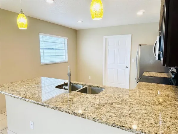 a view of a kitchen with a sink