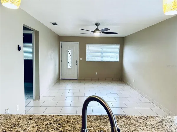 a view of an empty room with a window