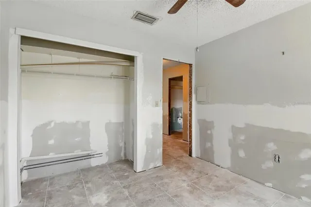 a white toilet sitting next to a bathroom sink and a shower