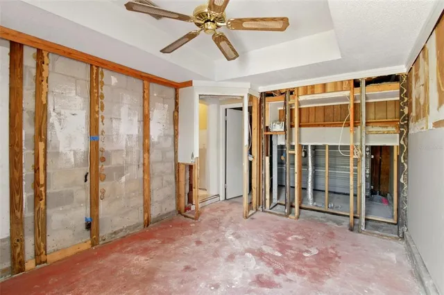 a view of a balcony with chairs and a potted plant