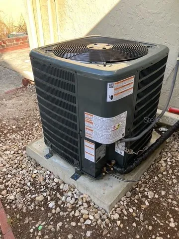 a view of a house with swimming pool and a yard
