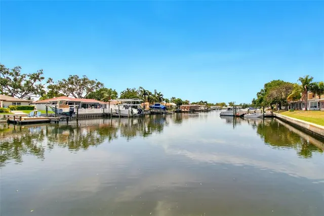 a view of yard with swimming pool and trees
