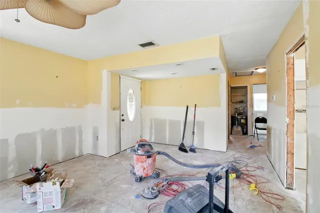 a living room with furniture and a table