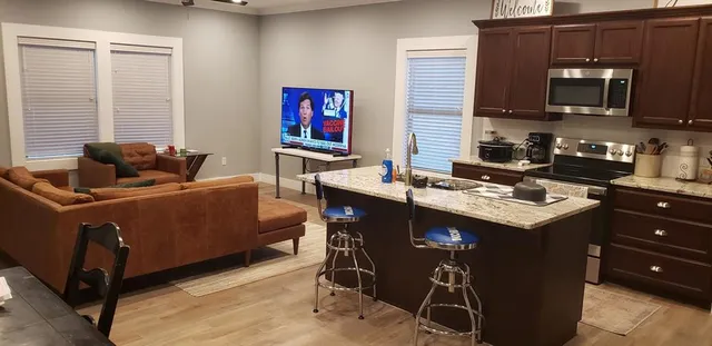 a kitchen with a stove a sink and a refrigerator