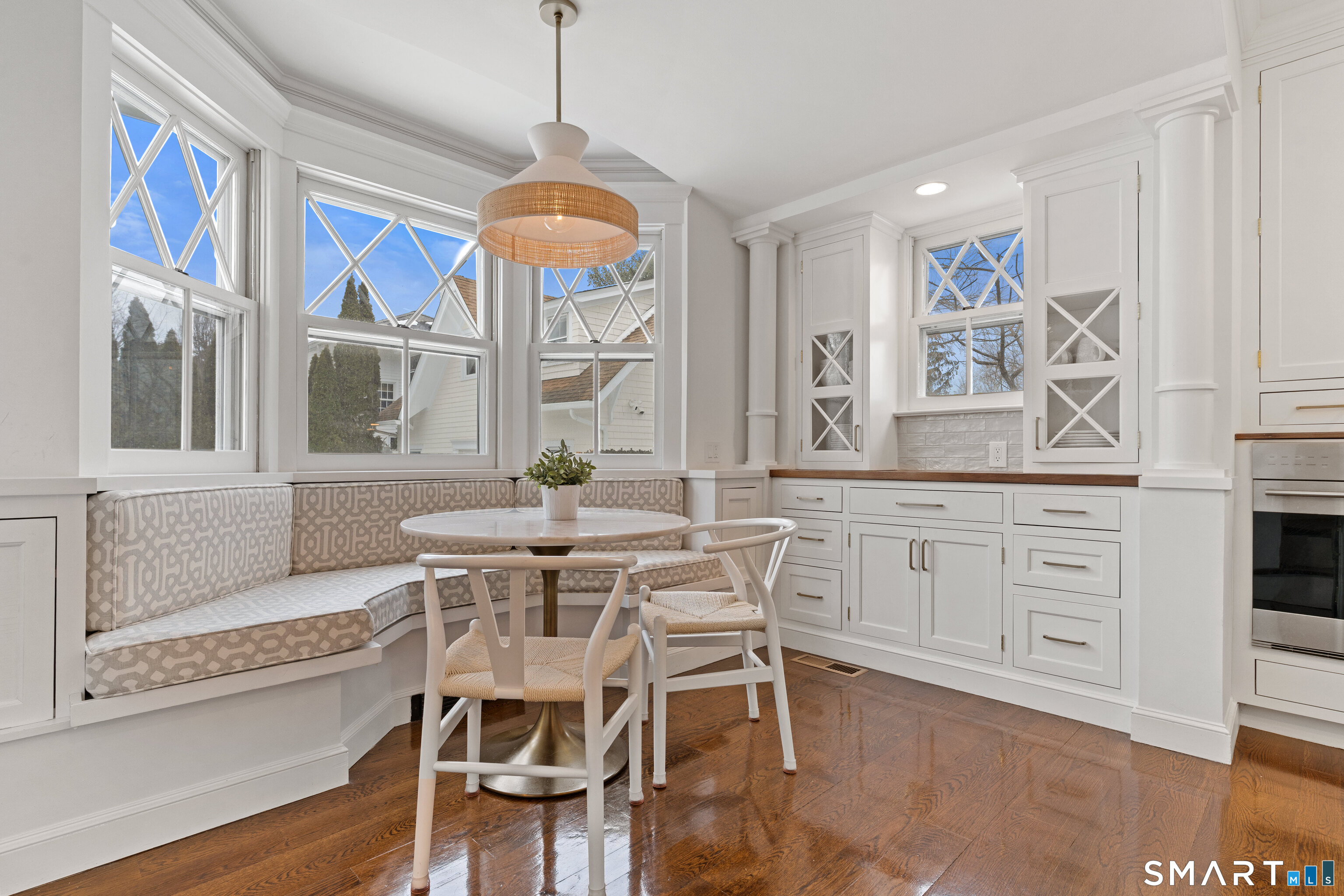 40 Rogers Road Stamford, CT 06902 - Photo 13 of 40 a view of a dining room with furniture a chandelier and wooden floor