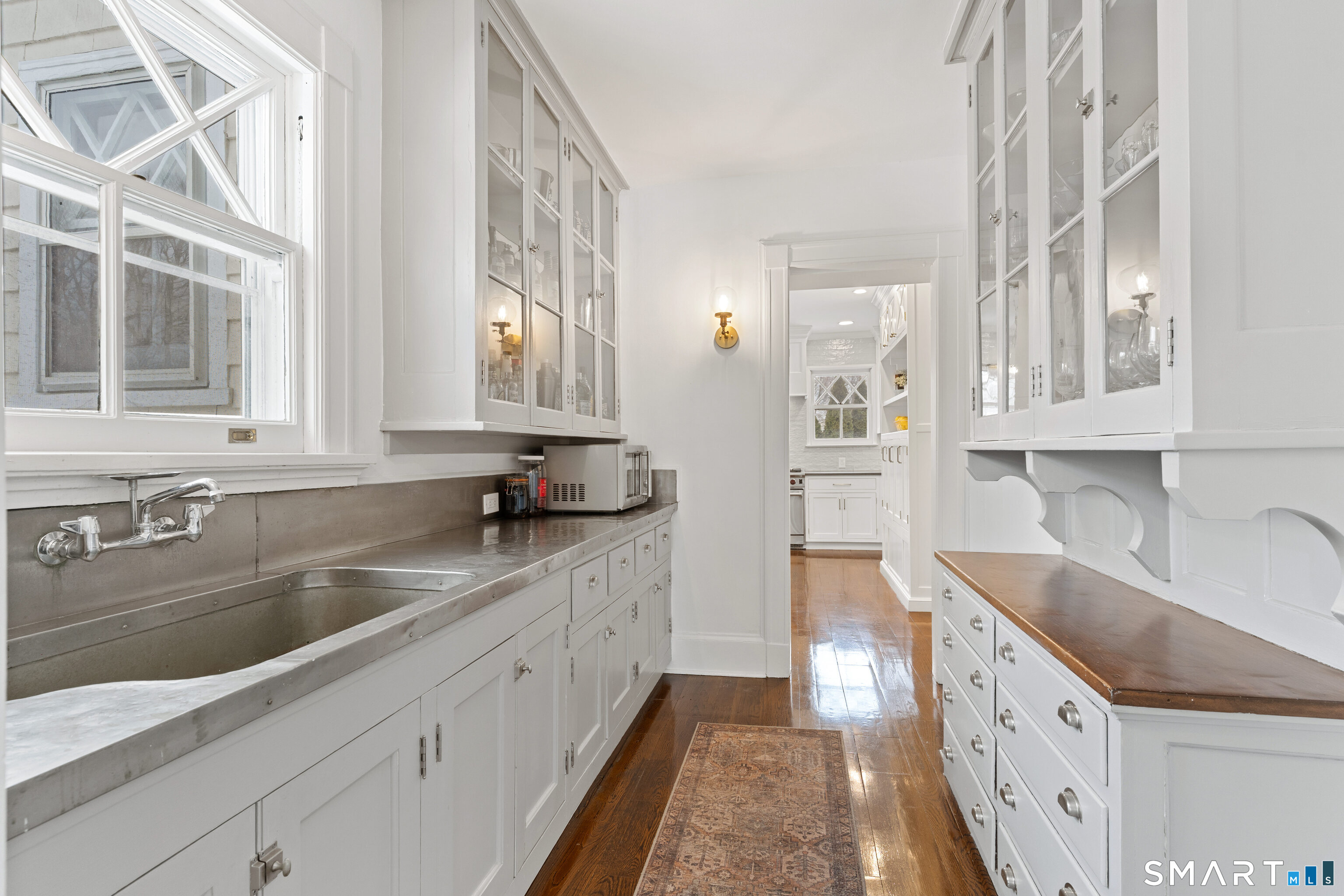40 Rogers Road Stamford, CT 06902 - Photo 16 of 40 a large kitchen with granite countertop a sink and dishwasher a stove with wooden floor