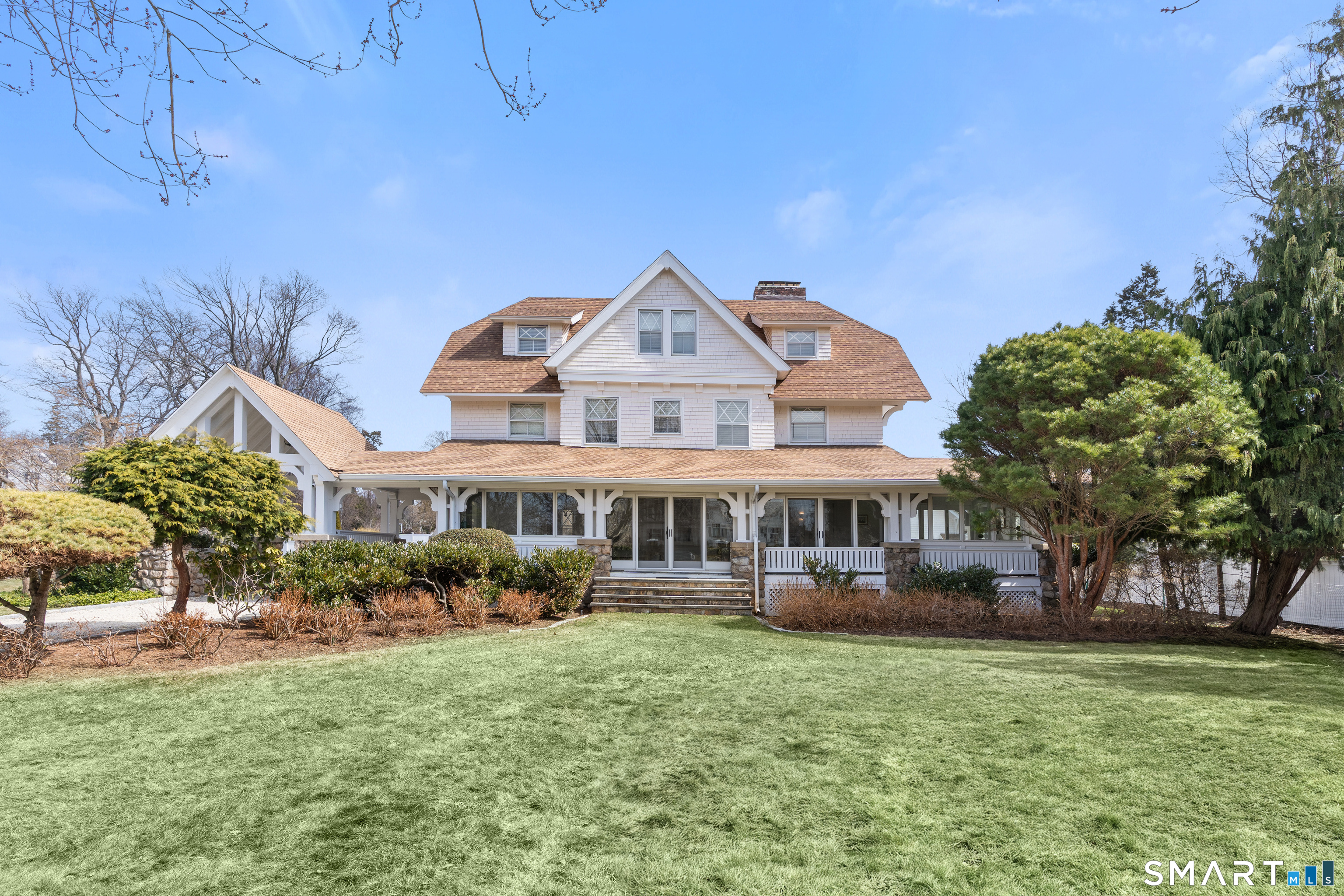 40 Rogers Road Stamford, CT 06902 - Photo 2 of 40 a front view of a house with a garden