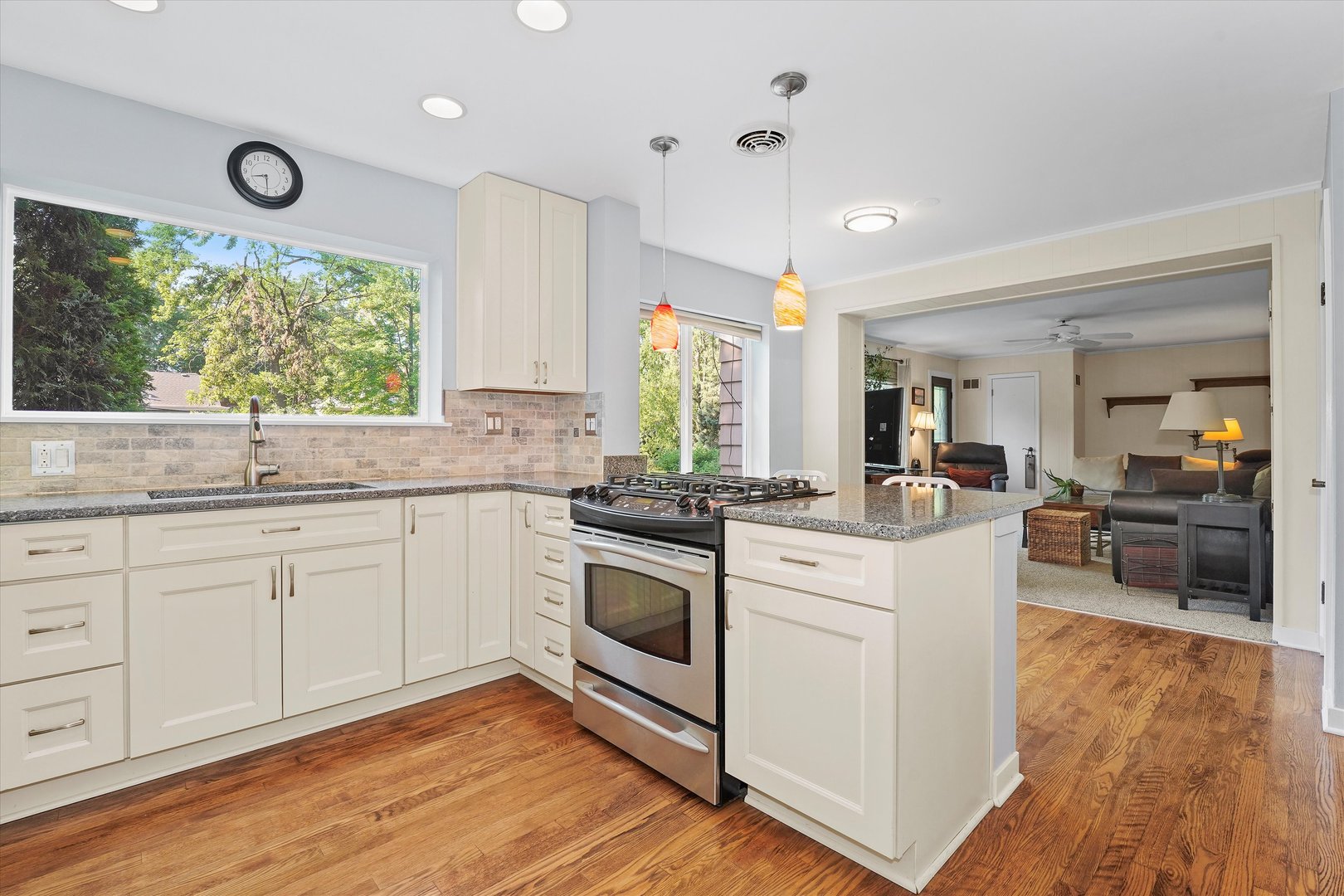 201 Herrick Road Riverside, IL 60546 - Photo 8 of 35 a kitchen with granite countertop white cabinets and white appliances