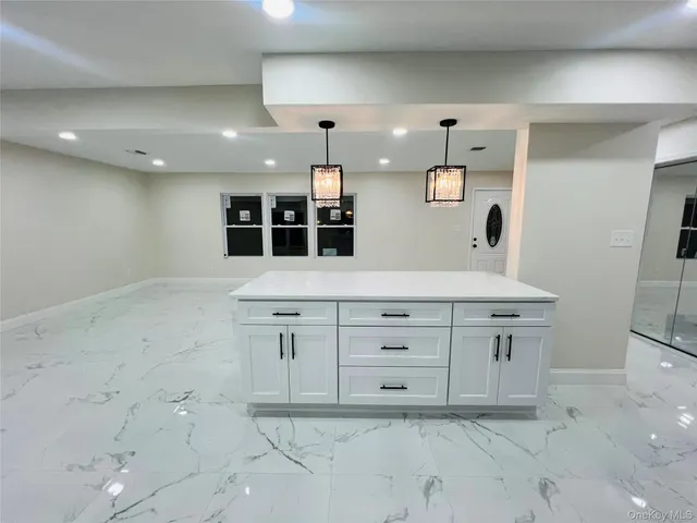 a view of a hallway with bathroom