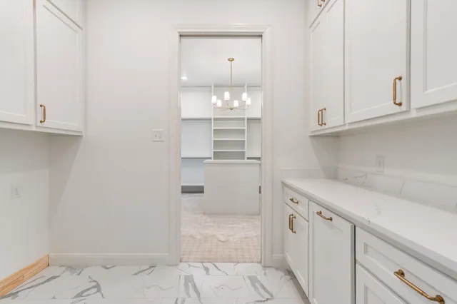 a kitchen with stainless steel appliances a sink stove and cabinets