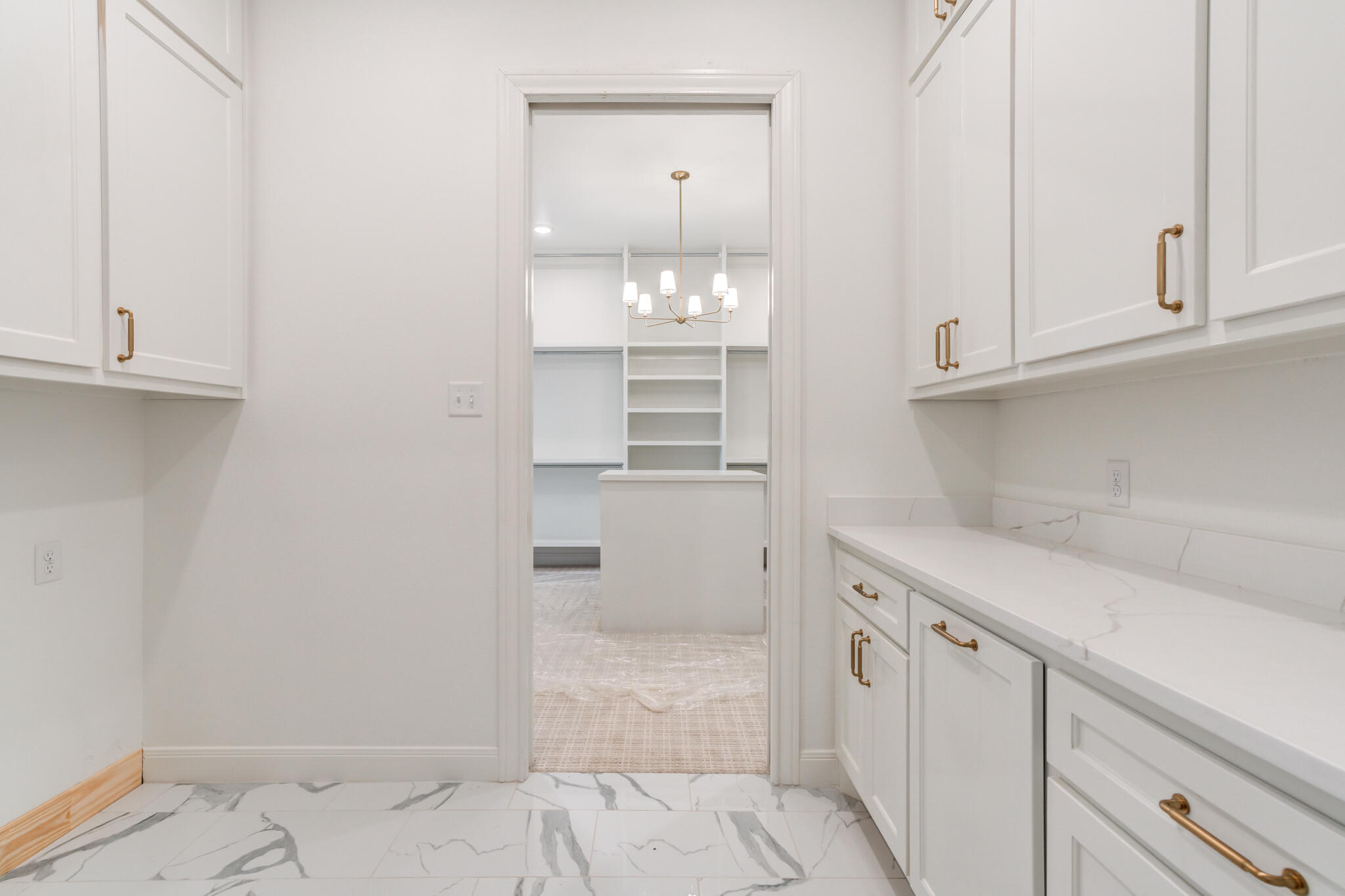 5309 County Road 7670 Lubbock, TX 79424 - Photo 15 of 57 a kitchen with white cabinets and a sink