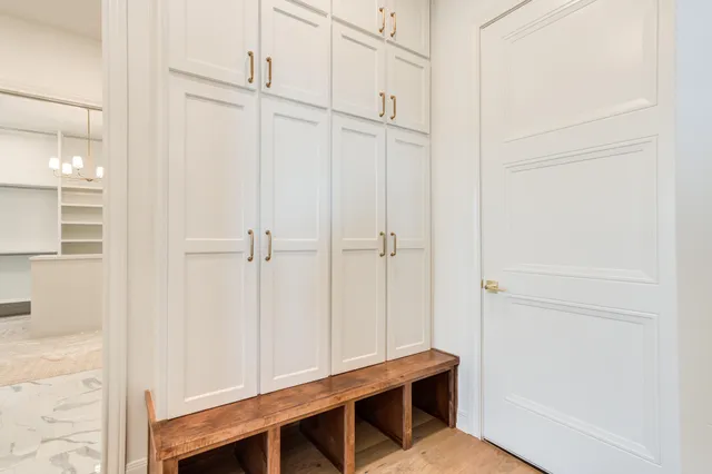 a view of cabinets with wooden floor and windows