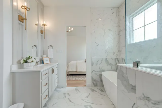 a bathroom with a sink a toilet and mirror