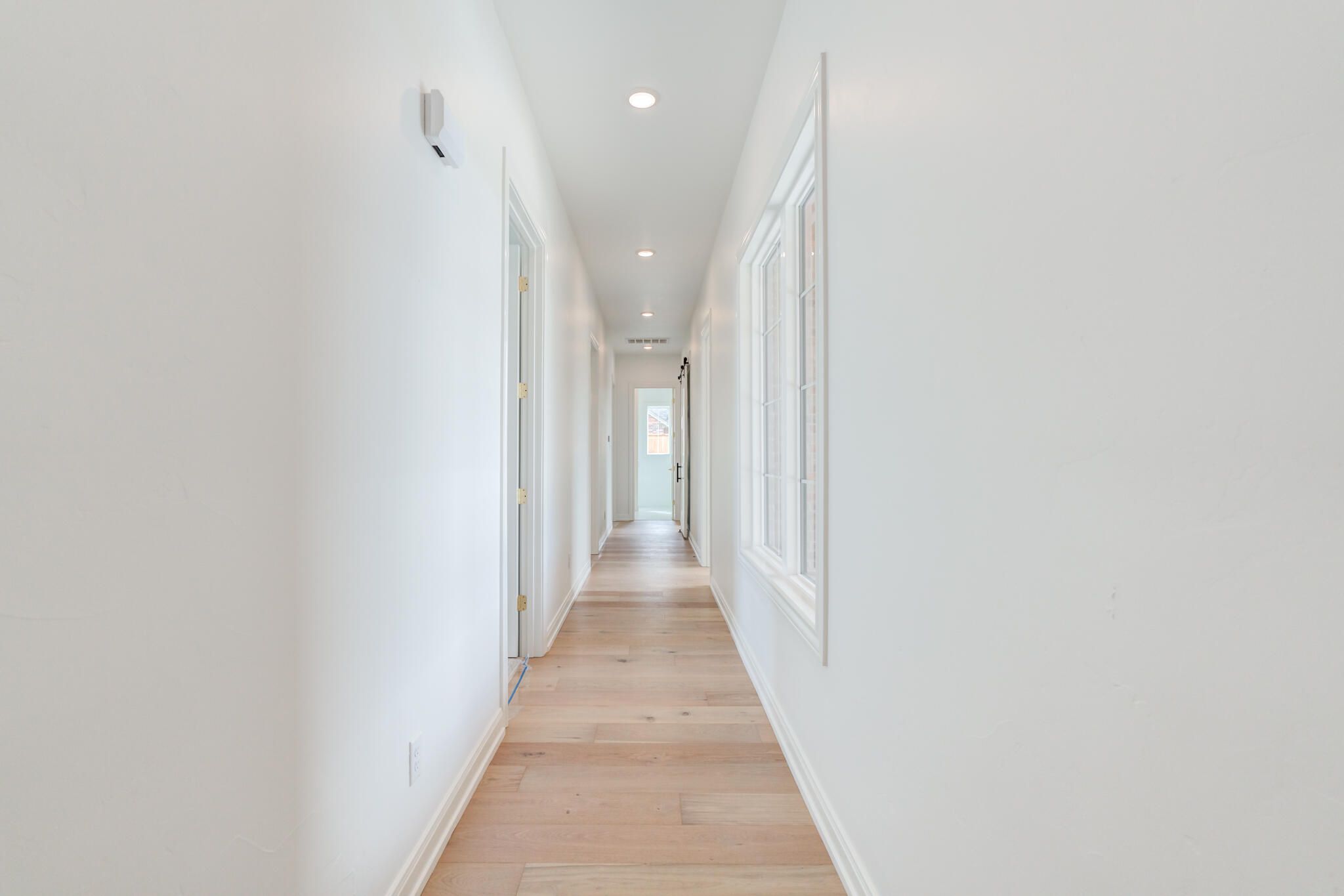5309 County Road 7670 Lubbock, TX 79424 - Photo 27 of 57 a view of a hallway with wooden floor