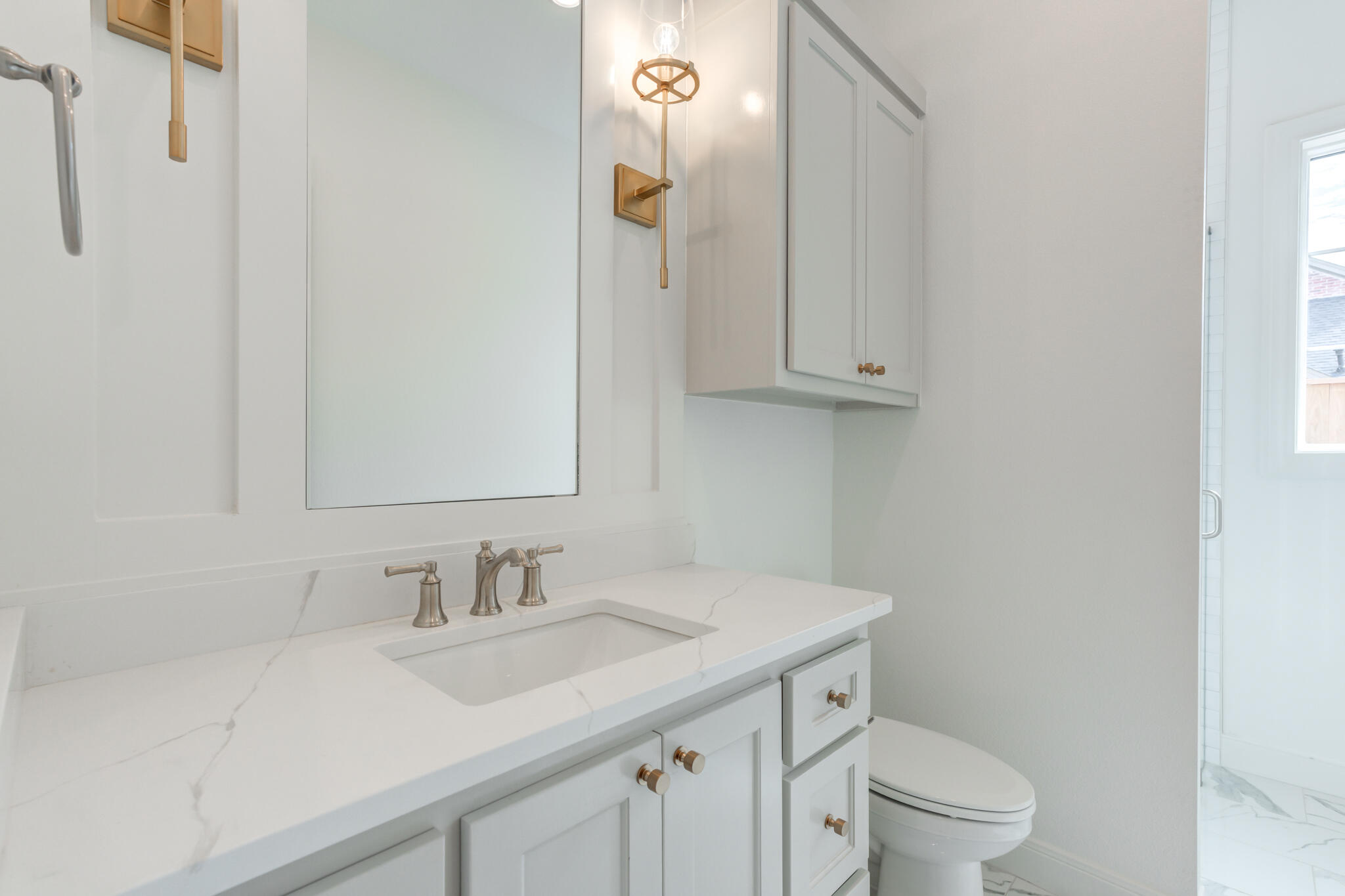 5309 County Road 7670 Lubbock, TX 79424 - Photo 29 of 57 a bathroom with a sink toilet and vanity