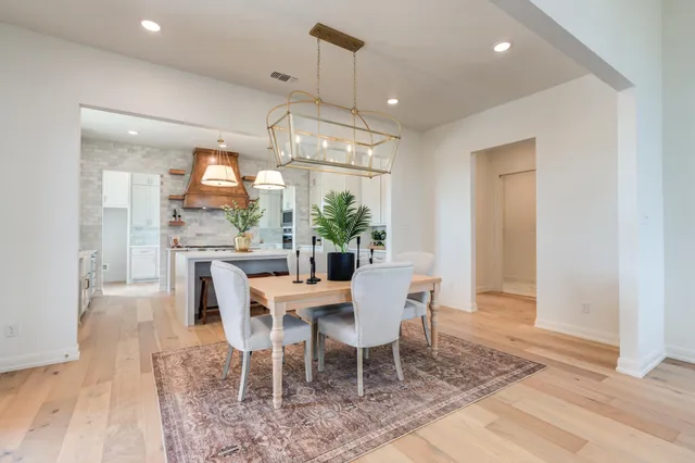 a white stove top oven sitting inside of a kitchen