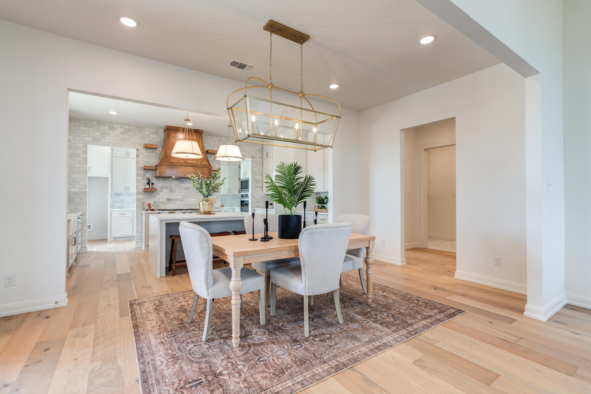 5309 County Road 7670 Lubbock, TX 79424 - Photo 36 of 57 a view of a dining room with furniture window and wooden floor