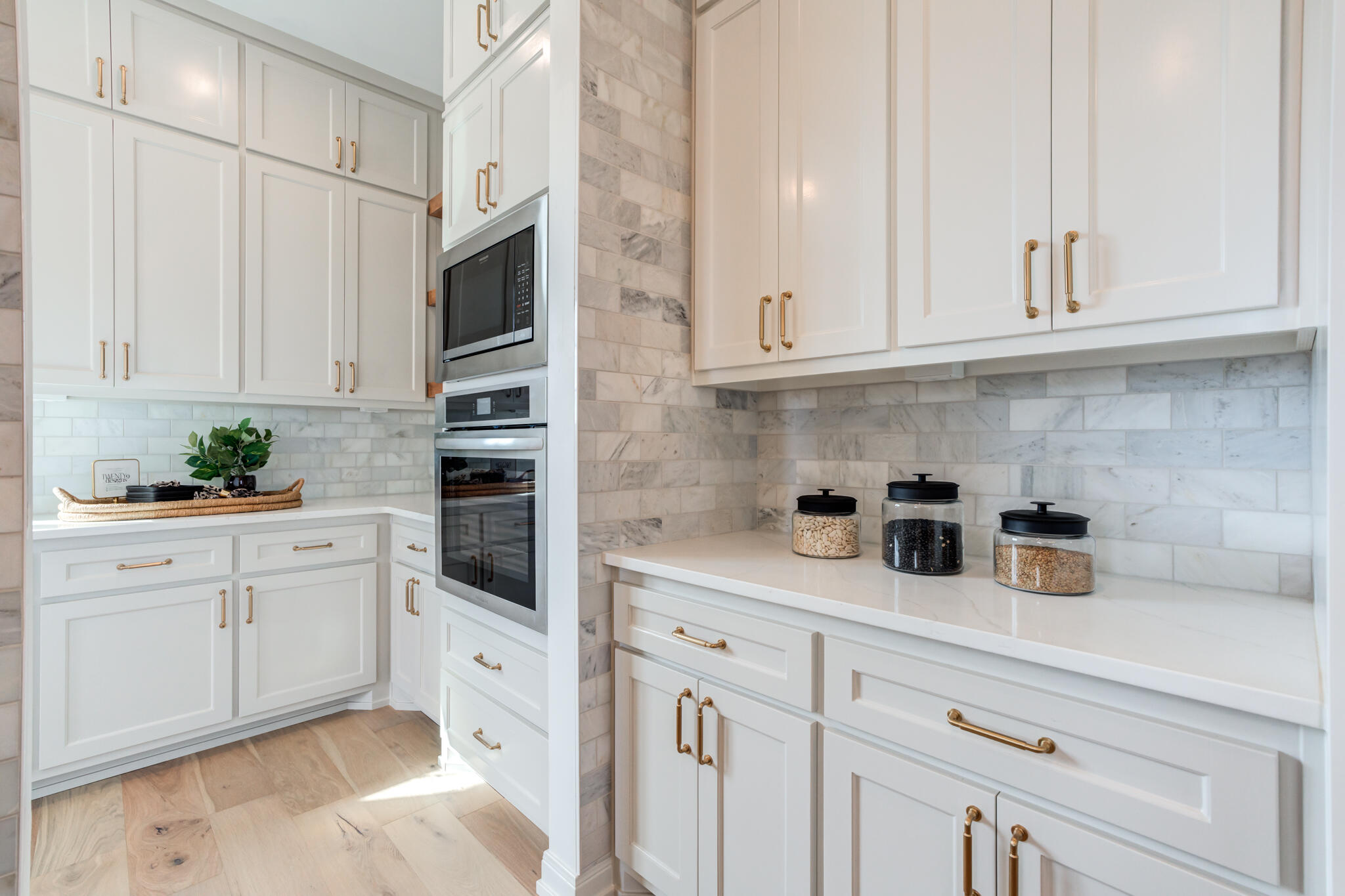 5309 County Road 7670 Lubbock, TX 79424 - Photo 39 of 57 a kitchen with stainless steel appliances granite countertop white cabinets a sink and dishwasher