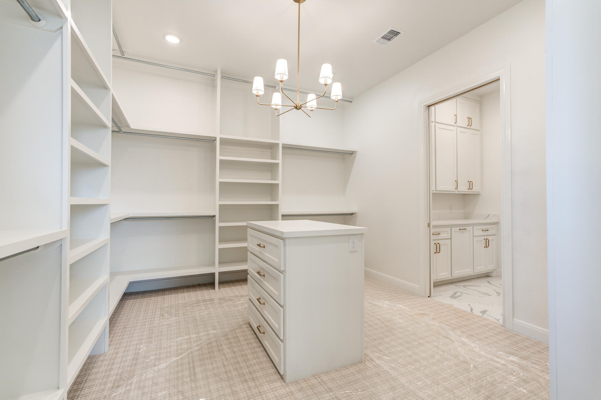 5309 County Road 7670 Lubbock, TX 79424 - Photo 45 of 57 a view of a kitchen with a dishwasher and white cabinets