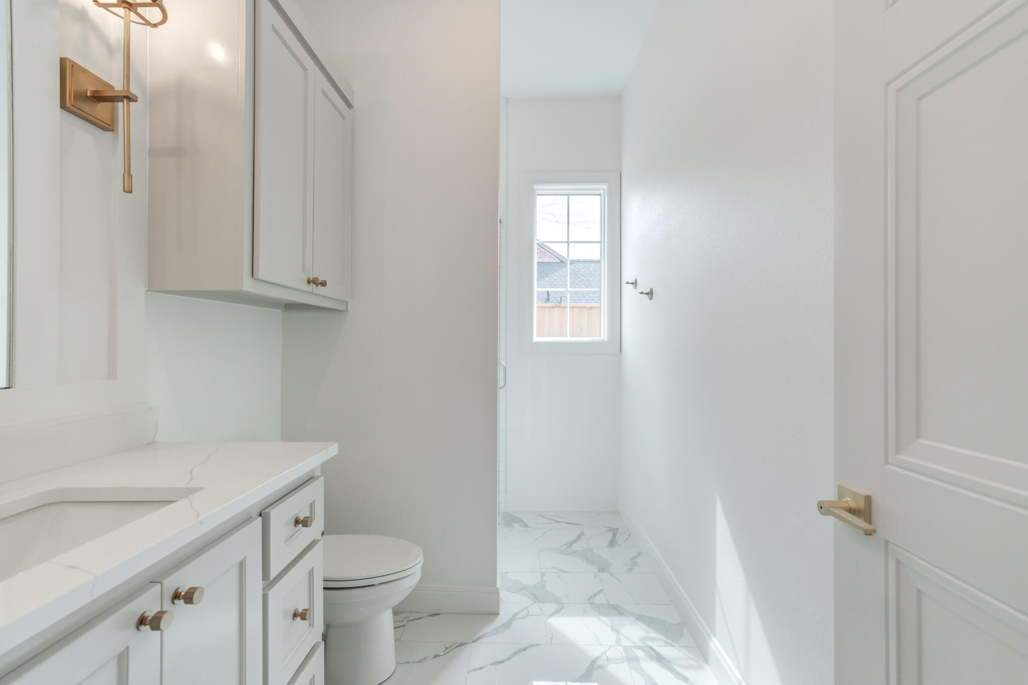 5309 County Road 7670 Lubbock, TX 79424 - Photo 52 of 57 a bathroom with a sink toilet and vanity