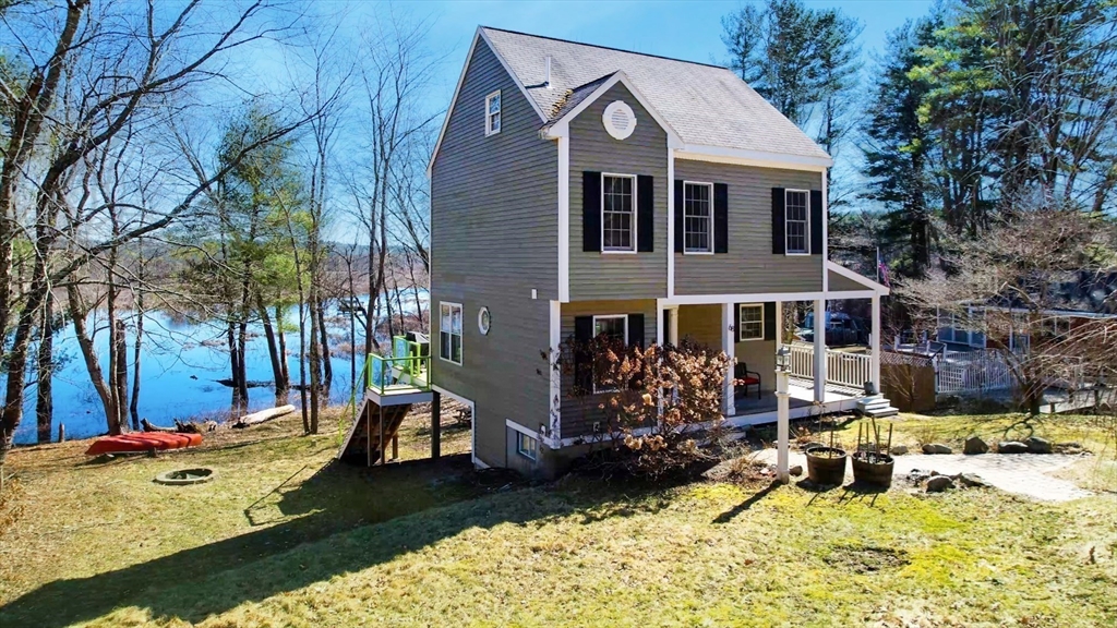 68 Meadow Cart Way Millis, MA 02054 - Photo 1 of 28 a view of a house with backyard porch and sitting area