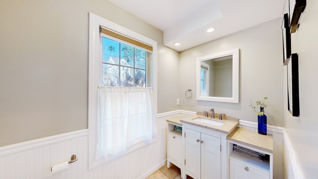 68 Meadow Cart Way Millis, MA 02054 - Photo 11 of 28 a bathroom with a sink vanity tub and a mirror
