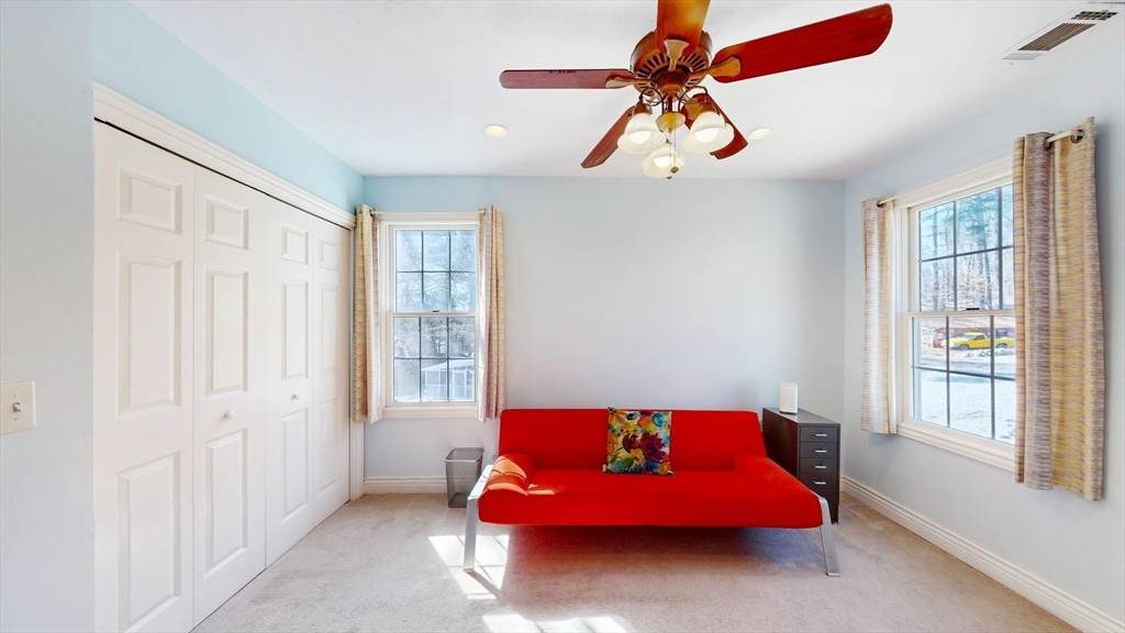 68 Meadow Cart Way Millis, MA 02054 - Photo 12 of 28 a bedroom with a bed and a chandelier