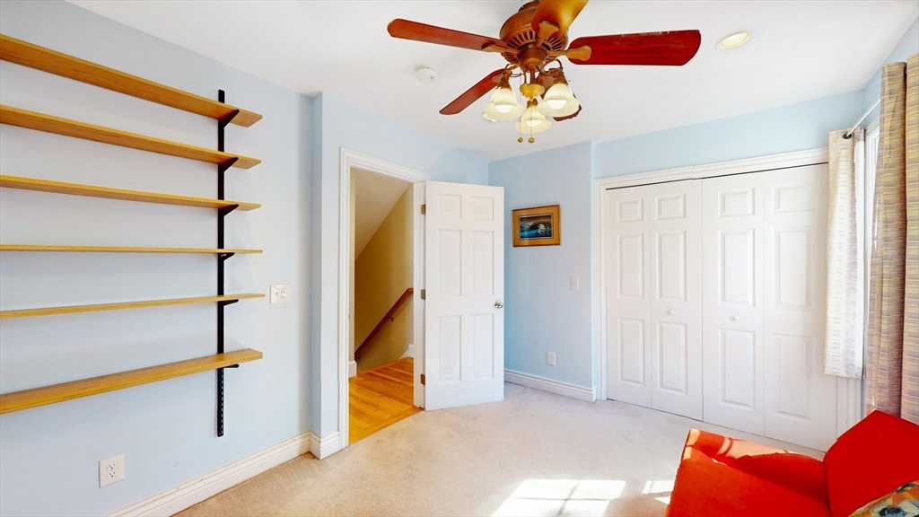 68 Meadow Cart Way Millis, MA 02054 - Photo 13 of 28 a view of a livingroom with a staircase