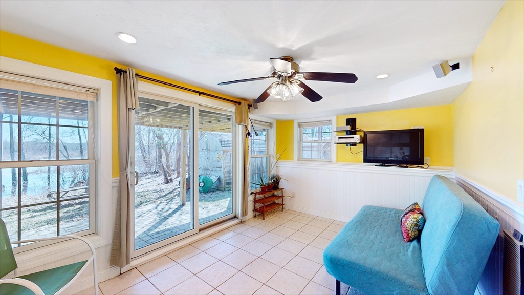 68 Meadow Cart Way Millis, MA 02054 - Photo 16 of 28 a living room with furniture and a flat screen tv