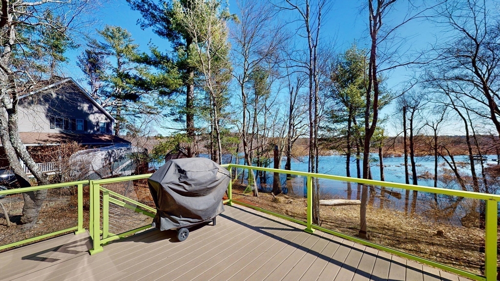 68 Meadow Cart Way Millis, MA 02054 - Photo 18 of 28 a view of a swimming pool with a lounge chair