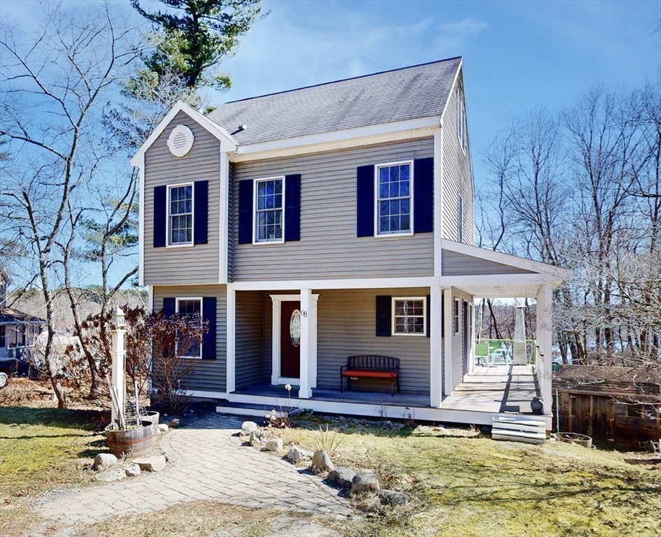 68 Meadow Cart Way Millis, MA 02054 - Photo 2 of 28 a front view of a house with a yard balcony and large tree